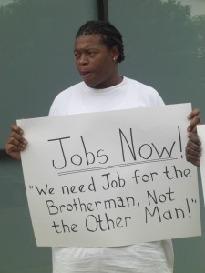 This protestor gathers in the West Loop to demand more construction jobs (Photo/Kelsey Duckett)